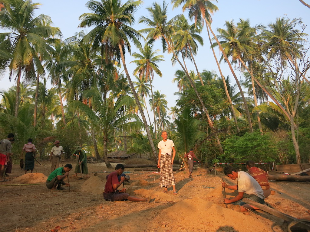 In the early morning the volunteer villagers are digging the holes for pole placement.