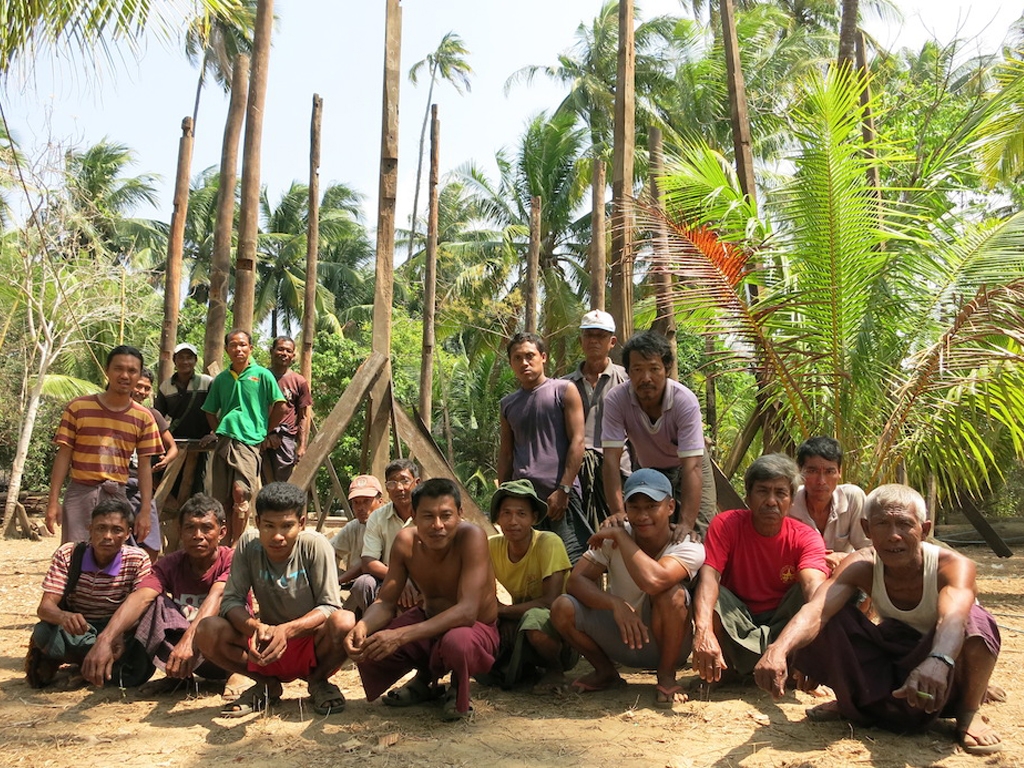 Our 19 men team after all poles for the first house have been erected.